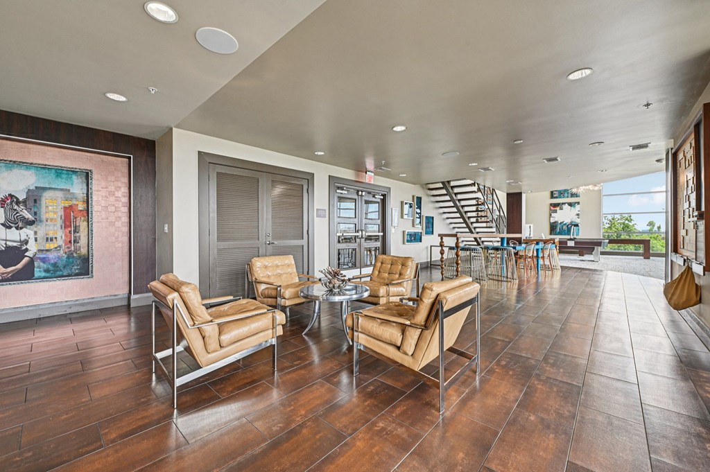 A living room with two chairs and a table.