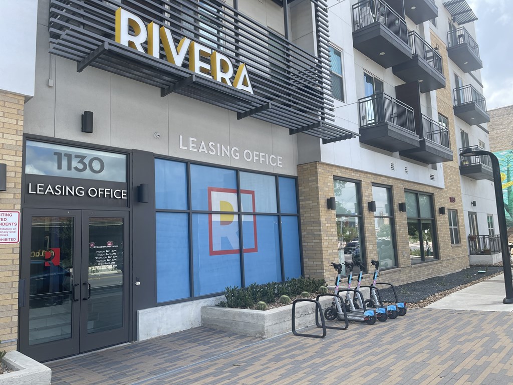 A building with a leasing office on the ground floor.