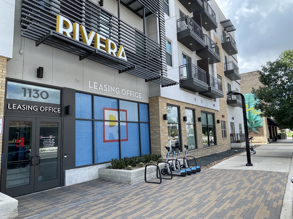 A building with a leasing office for the Rivera apartments.