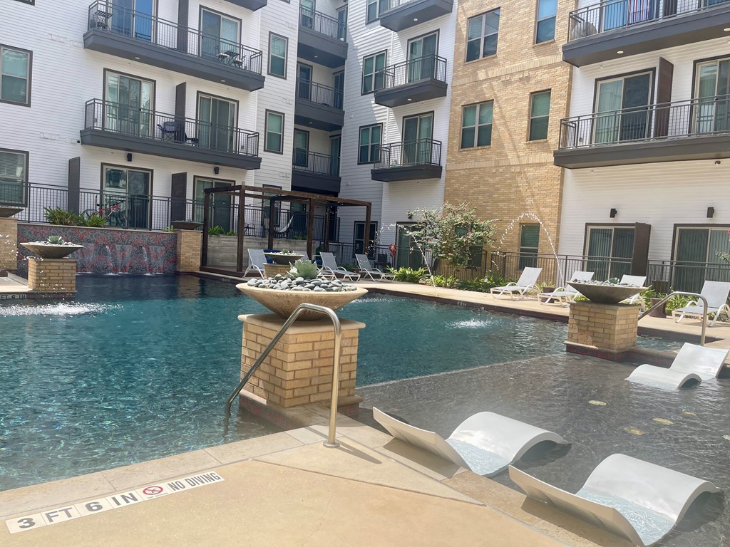 A pool with a 3ft depth sign in the foreground.