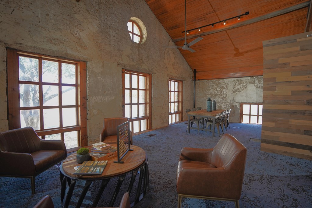 a room with a table and chairs in it