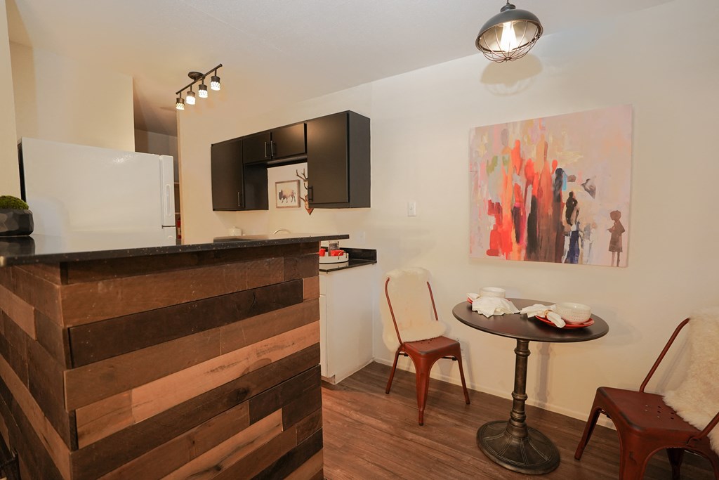 a kitchen and dining area in a 555 waverly unit