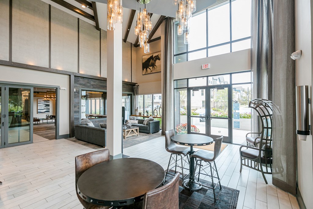 a dining room with a table and chairs in a lobby