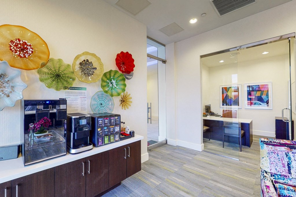 a store with colorful plates on the wall and coffee machines
