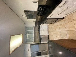 a kitchen with a stove and a microwave