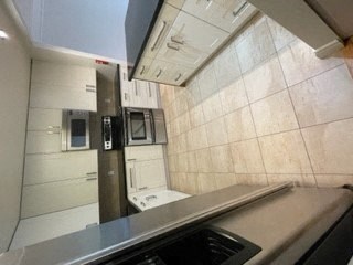 a kitchen with a stove and a microwave