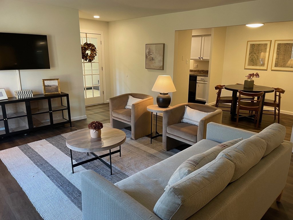 A living room with a grey sofa and a coffee table.