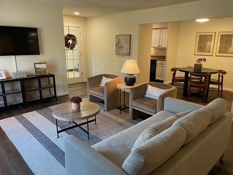 A living room with a grey sofa and a coffee table.