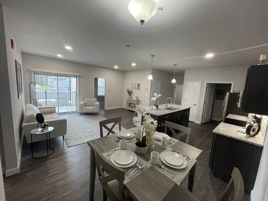 an open floor plan with a dining table and kitchen