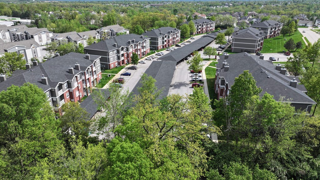A bird's eye view of a residential area with houses and trees.