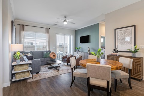 an open living room and dining room with a couch and a table