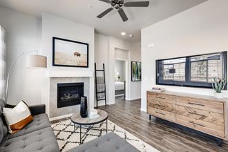 Living Room With Television and Fireplace at Avilla Eastlake, Colorado, 80241