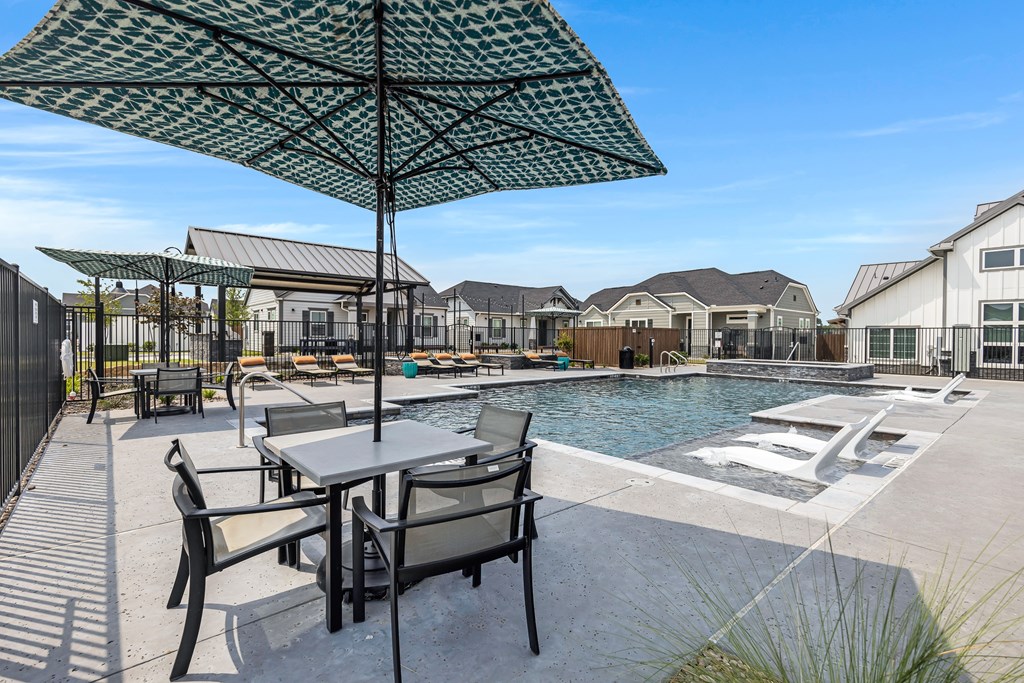 Resort-style pool and lounging at Avilla Oakridge in Forney, TX.