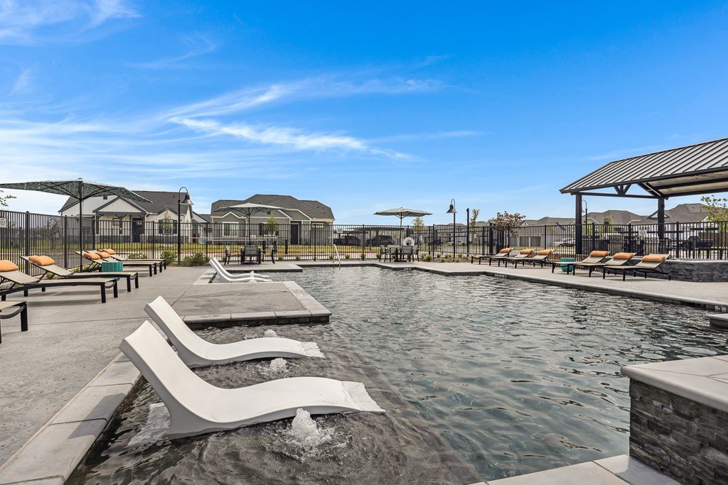 Resort-style pool and lounging at Avilla Oakridge in Forney, TX.