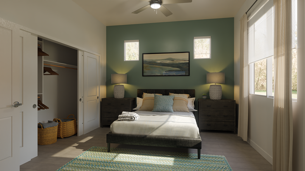 a bedroom with a bed and a ceiling fan