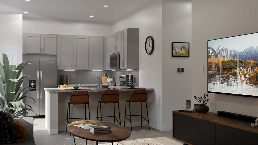 a view of a kitchen with a bar and a large screen tv