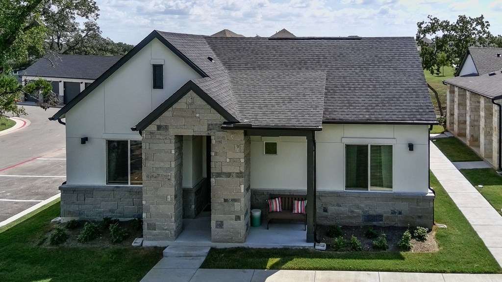 A house with a grey roof and a white exterior.