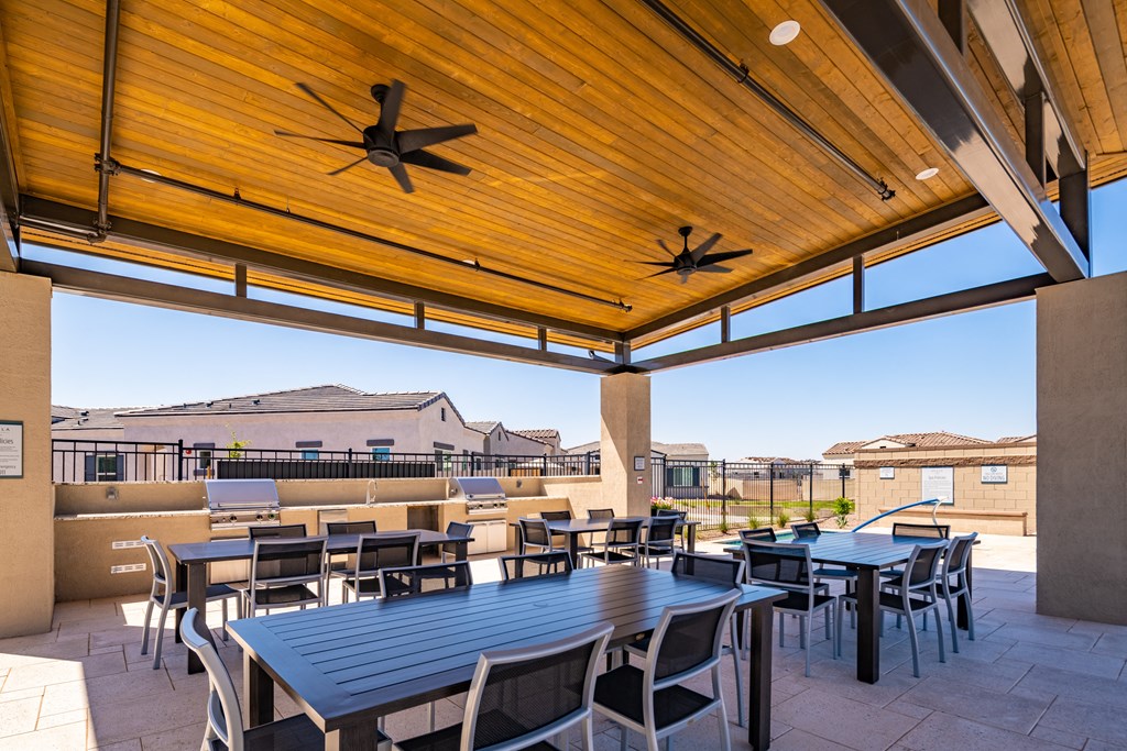 Entertain by the pool with friends in our Gourmet Grilling Areas at Avilla Grand in El Mirage, AZ.