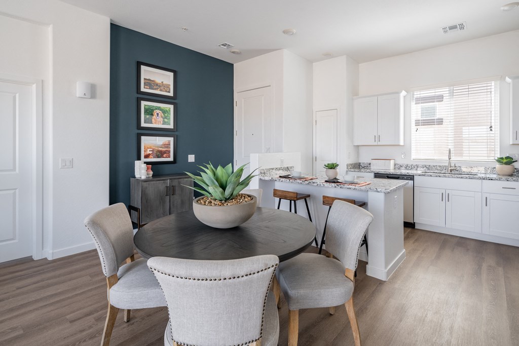 Dining area and Granite Countertops in our 3-bedroom Retreat Floor Plan at Avilla Grand in El Mirage, AZ.