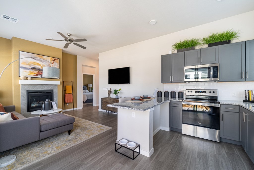Tall cielings and a stainless steel kitchen at Avilla Eastlake in Thornton, CO.
