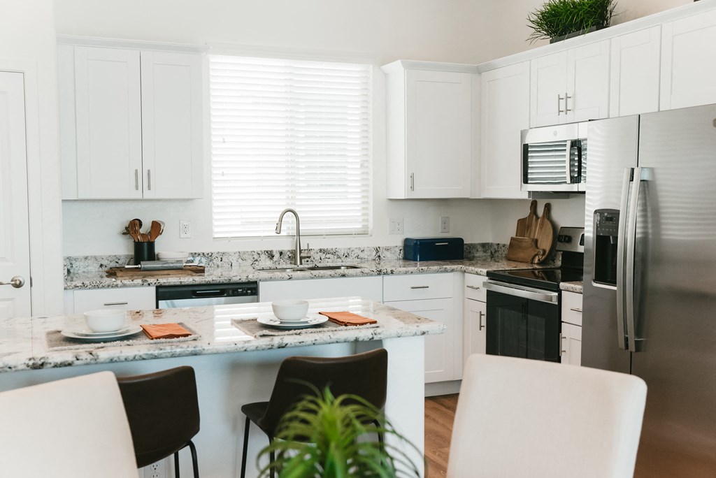 Kitchen and dining at Avilla Broadway Apartments, Phoenix, AZ