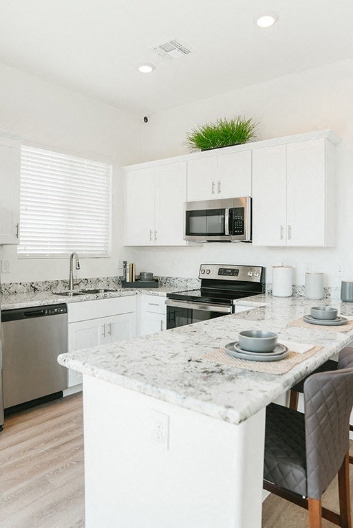 Gourmet Kitchen With Island at Avilla Grand, El Mirage