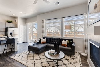 Living Room With Kitchen View at Avilla Buffalo Run, Commerce City, CO