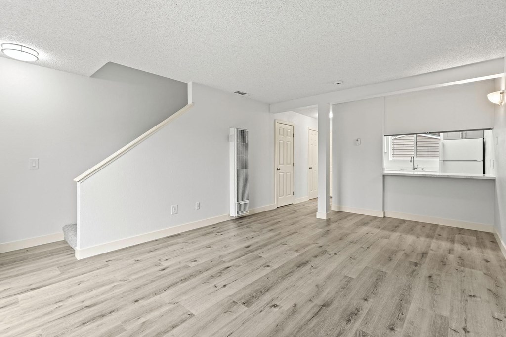 A room with a wooden floor and a staircase at Stony Creek Apartments, California, 95401