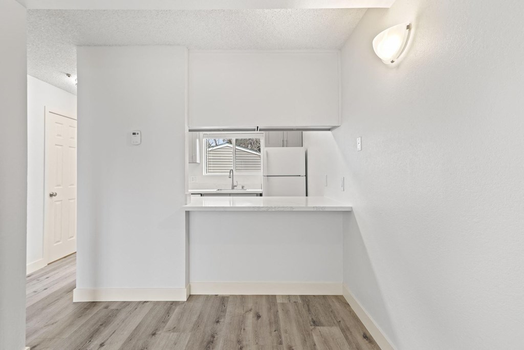 A white kitchen with a window and a sink at Stony Creek Apartments, Santa Rosa, 95401