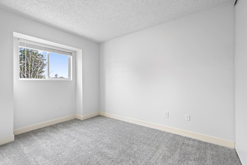 A room with a window and carpeted floor at Stony Creek Apartments, Santa Rosa, CA