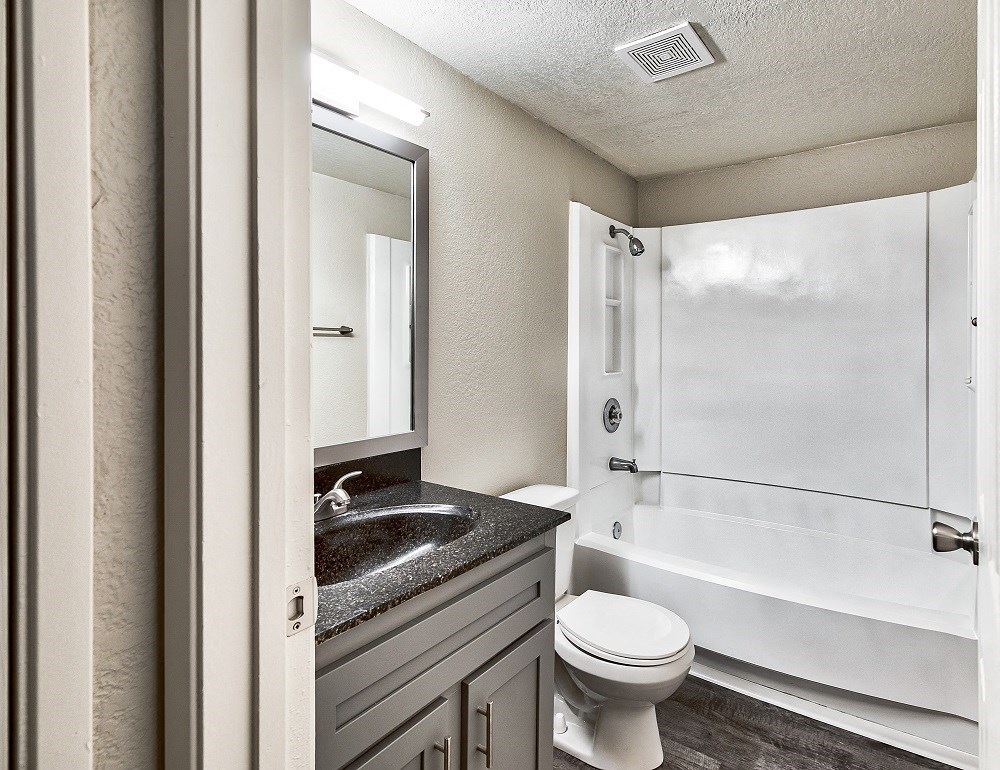 a bathroom with a sink toilet and bathtub