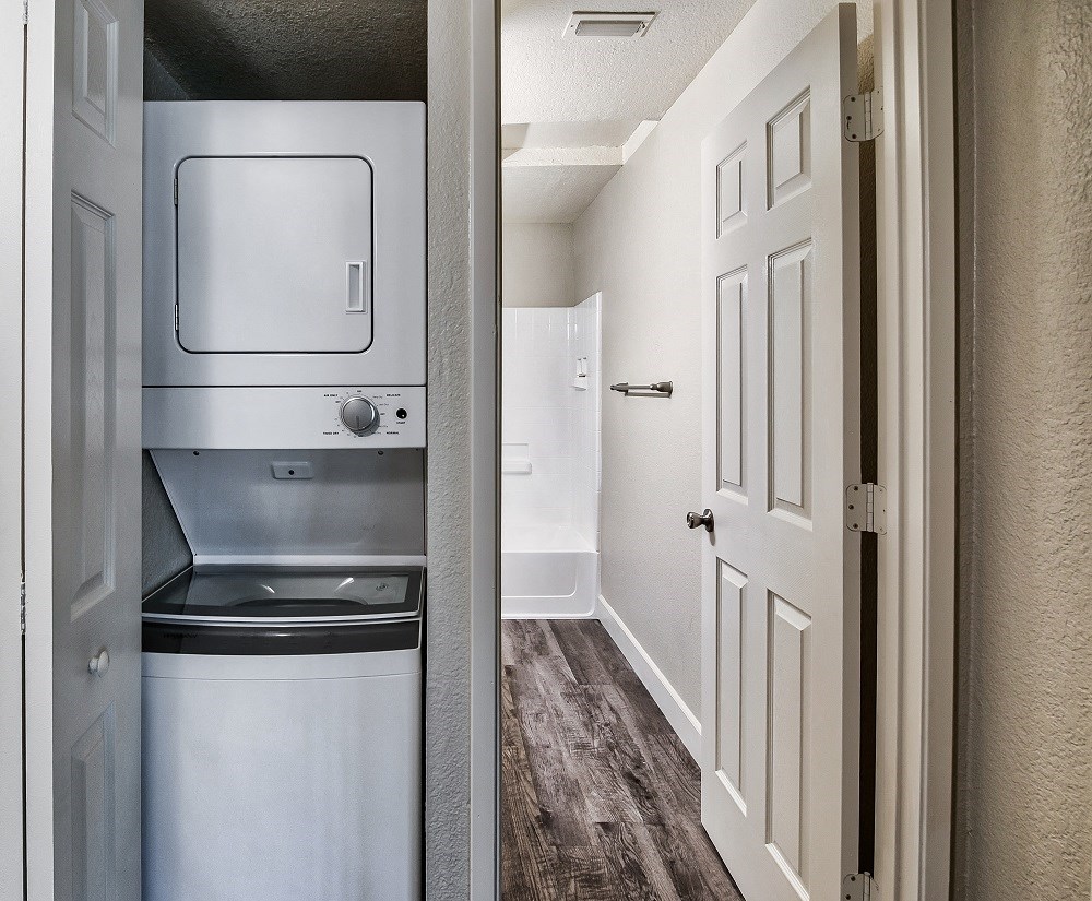 a laundry room with a washer and dryer