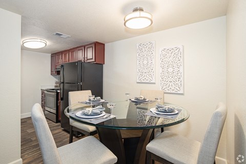 our modern kitchen and dining room is equipped with a glass table and chairs