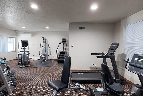 Newly renovated gym with equipment at Amber Crossing apartments in Fargo, North Dakota.