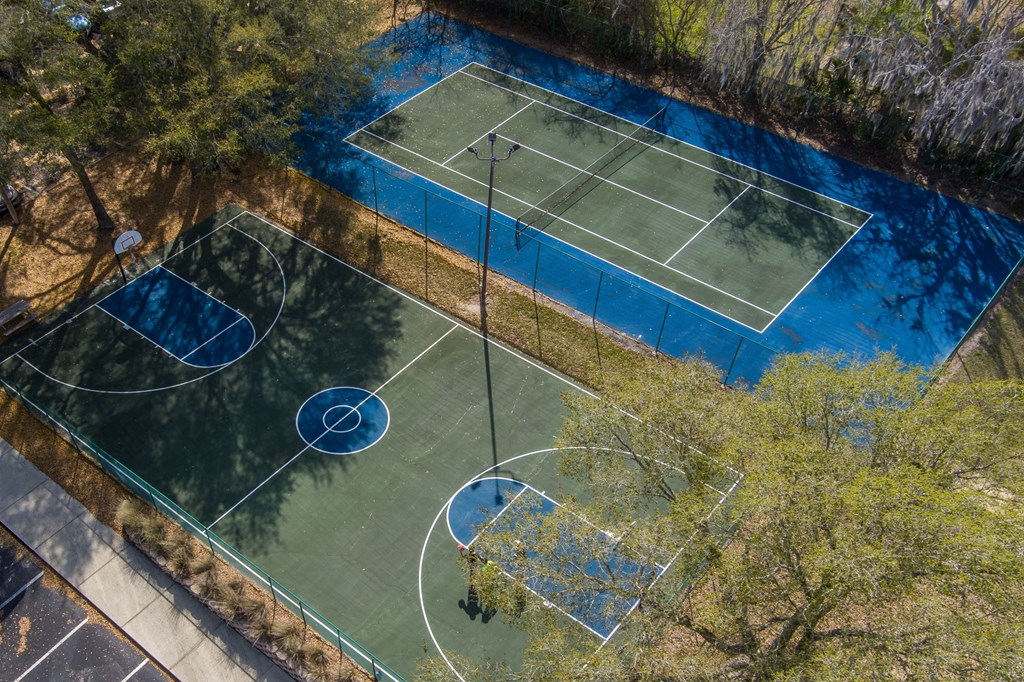 an aerial view of two basketball courts on a tennis court