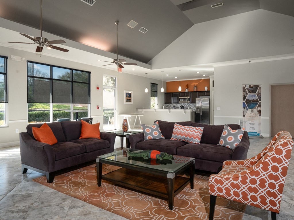 a living room with couches and a coffee table at Tivoli Apartments, Gainesville, FL