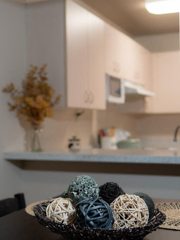 a bowl of balls on a table in a kitchen