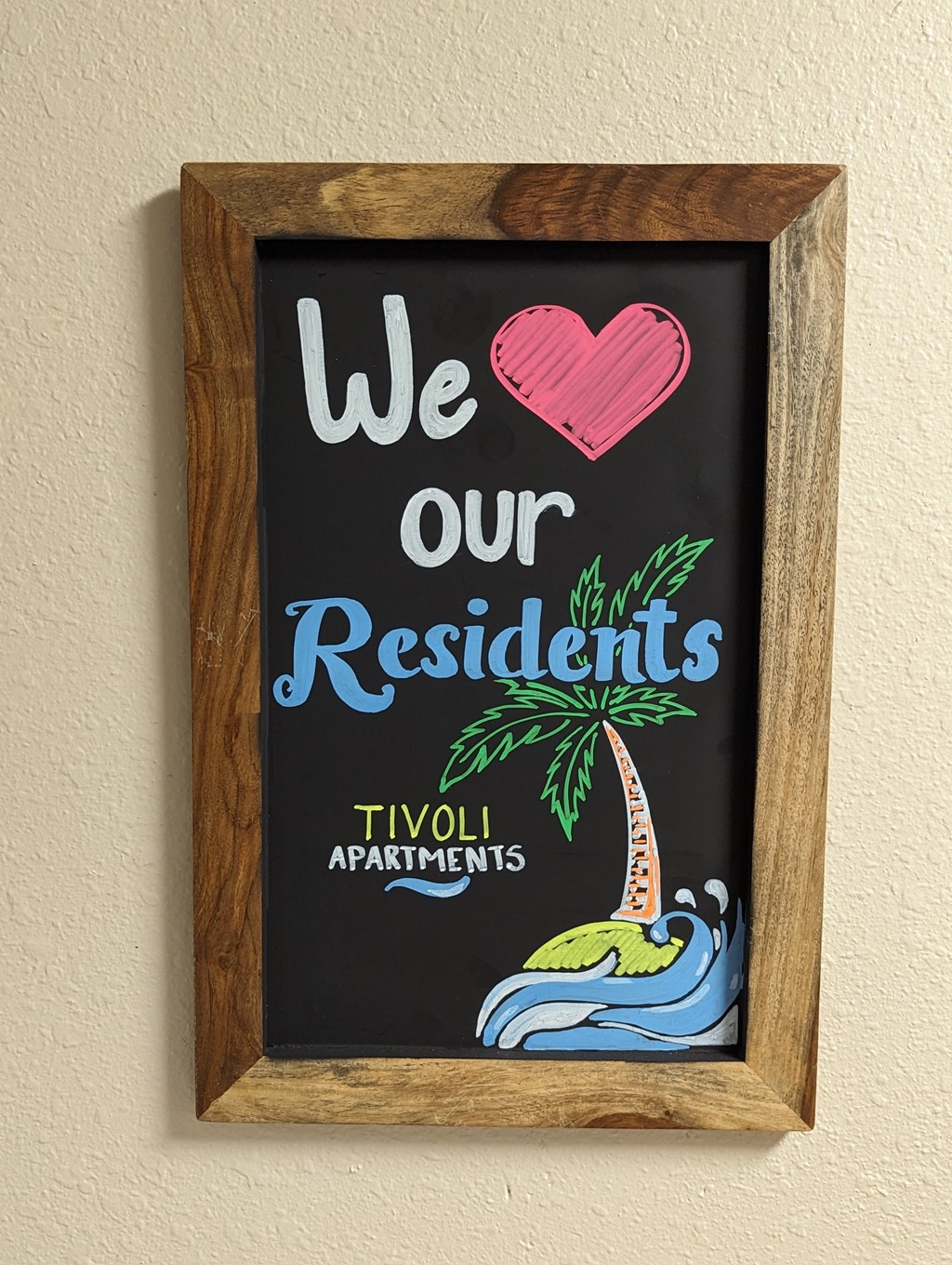 a framed sign that says we our residents and our residentsovy apartments at Tivoli Apartments of Orlando, Oviedo, 32765