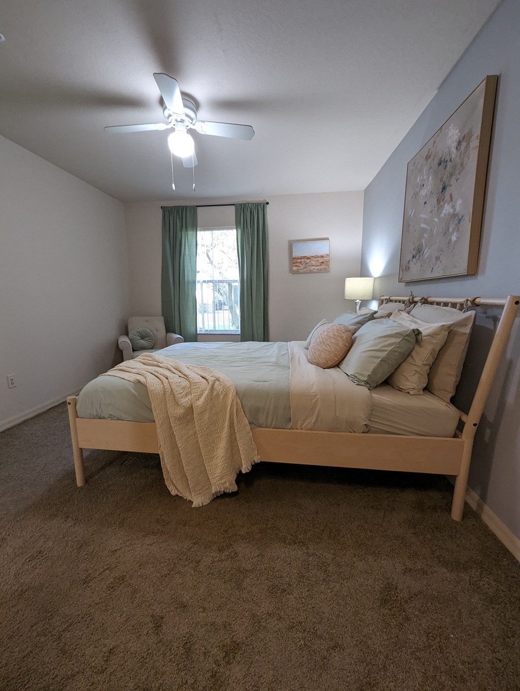a bedroom with a bed and a ceiling fan at Tivoli Apartments of Orlando, Oviedo, 32765