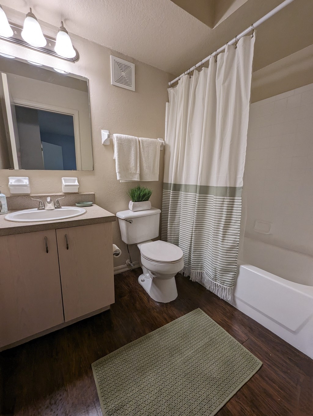 a bathroom with a toilet and a sink and a shower at Tivoli Apartments of Orlando, Oviedo, Florida, 32765