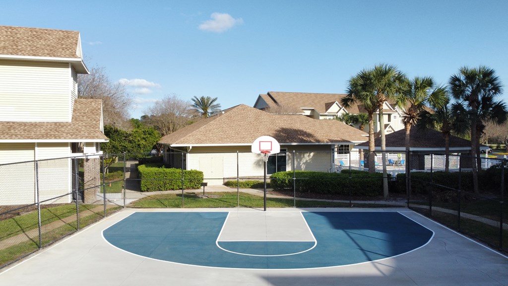 a basketball court in the backyard of a house at Tivoli Apartments of Orlando, Florida, 32765