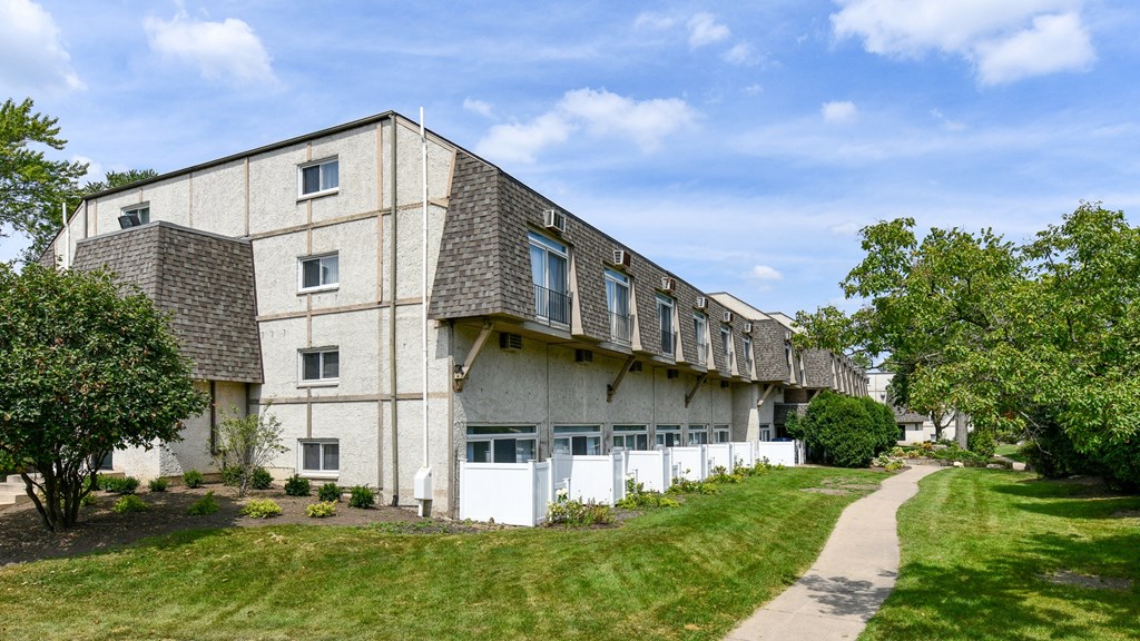 the exterior of a building with a sidewalk in front of itat Fox Run Apartments, St. Charles, 60174