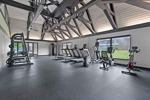A spacious gym with a variety of exercise equipment.