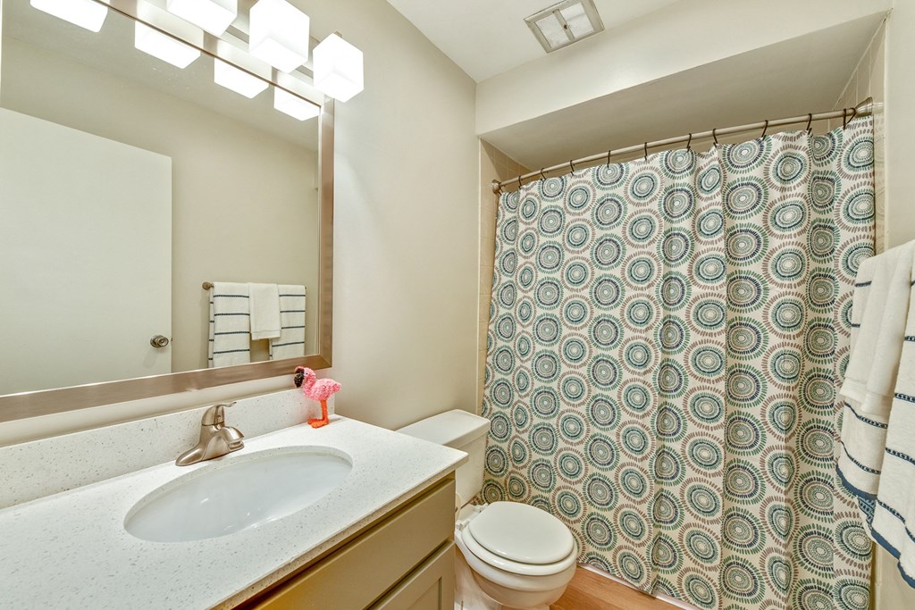Bathroom with bright lighting at Aspen Ridge Apartments in West Chicago Illinois 60185