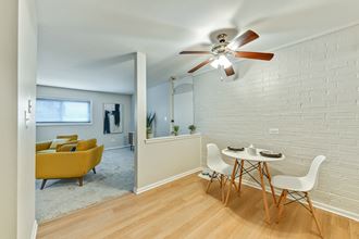 Dining area that opens up into living room space at Aspen Ridge Apartments in West Chicago Illinois 60185