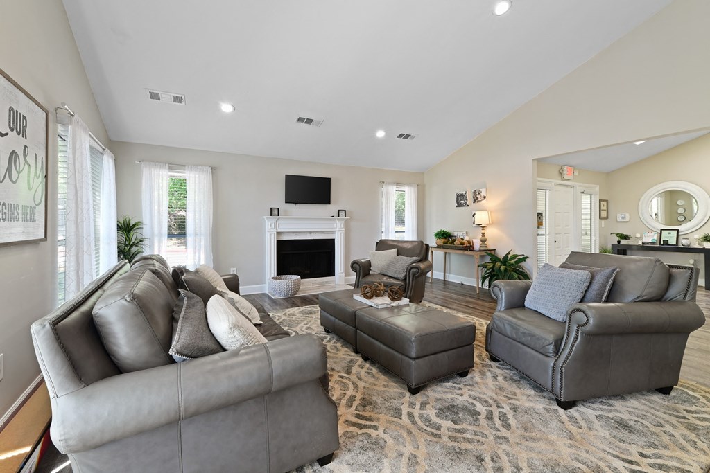 a living room filled with furniture and a fireplace at 300 Riverside Apartments, Austell