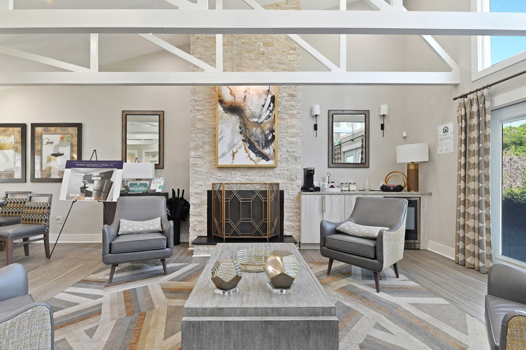 a living room filled with furniture and a fire place at Premier Apartments, Austell, 30168