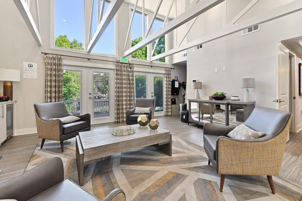 a living room filled with furniture and a large window at Premier Apartments, Austell, Georgia