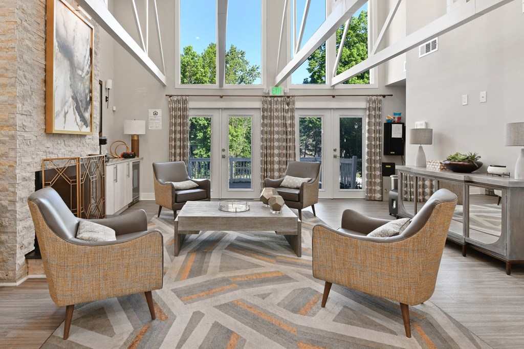 a living room filled with furniture and a large window at Premier Apartments, Georgia, 30168