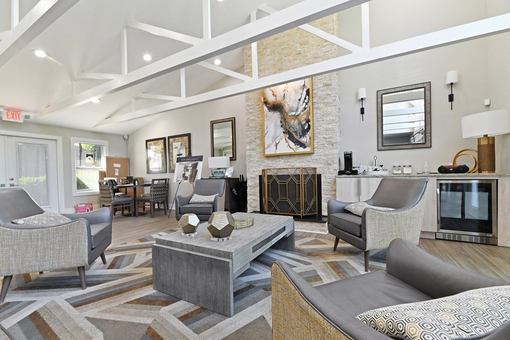 a living room filled with furniture and a fire place at Premier Apartments, Austell, GA, 30168